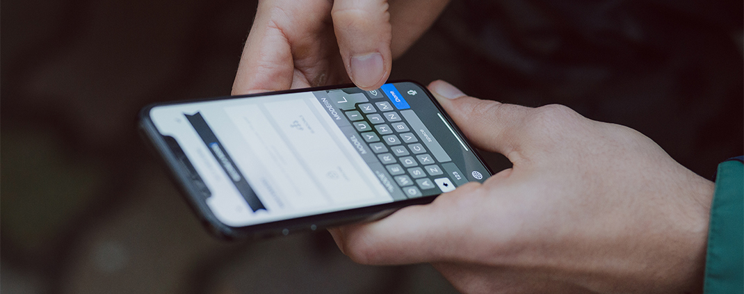 hands holding cell phone